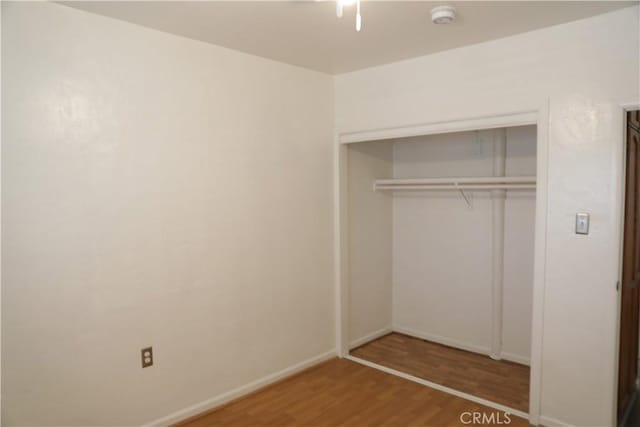15154 Oliva Ave, Paramount, CA 90723 - unfurnished bedroom featuring wood finished floors and a closet