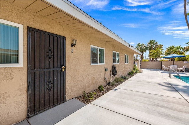 509561 S Highland Dr, Palm Springs, CA 92264 - entrance to property with stucco siding and a patio area