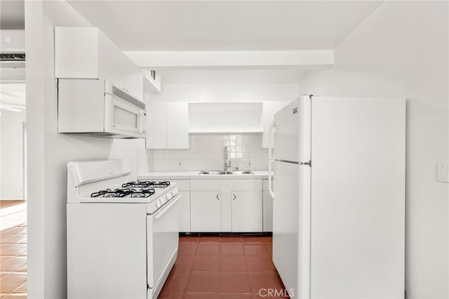509561 S Highland Dr, Palm Springs, CA 92264 - kitchen featuring white appliances, white cabinetry, light countertops, backsplash, and dark tile patterned flooring