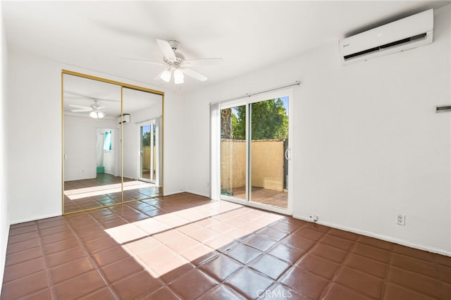 509561 S Highland Dr, Palm Springs, CA 92264 - spare room featuring a wall unit AC, ceiling fan, and tile patterned flooring