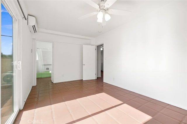 509561 S Highland Dr, Palm Springs, CA 92264 - empty room featuring a wall unit AC, a ceiling fan, and tile patterned floors