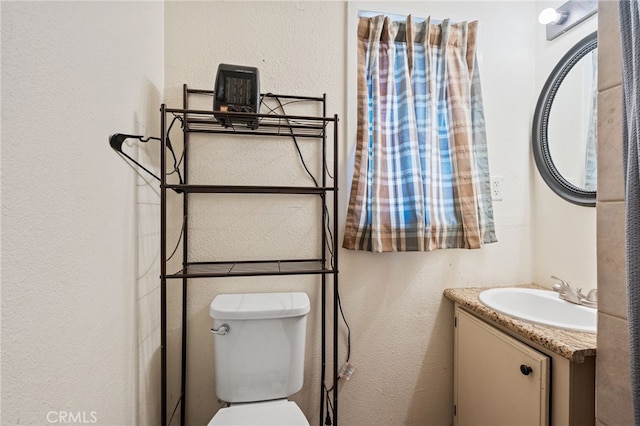4491 N Dewitt Ave, Fresno, CA 93727 - half bath with vanity and a textured wall