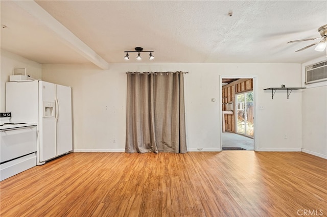 4491 N Dewitt Ave, Fresno, CA 93727 - unfurnished living room featuring light wood-style floors, ceiling fan, a wall unit AC, and a textured ceiling