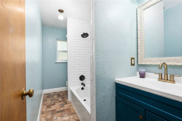 4491 N Dewitt Ave, Fresno, CA 93727 - full bath with vanity, stone finish floors, and bathing tub / shower combination