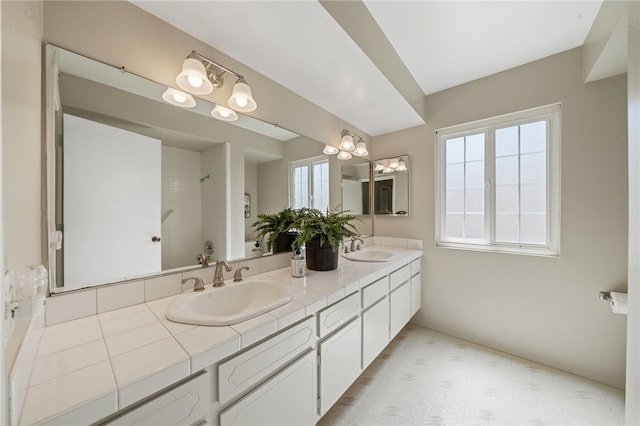 514 Mohawk Dr, Placentia, CA 92870 - full bathroom with double vanity, a chandelier, tile patterned floors, and a tile shower