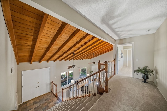 514 Mohawk Dr, Placentia, CA 92870 - hallway with an upstairs landing, carpet floors, and a wooden ceiling with exposed beams