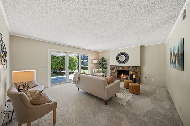 514 Mohawk Dr, Placentia, CA 92870 - living area with carpet, a stone fireplace, crown molding, and a textured ceiling