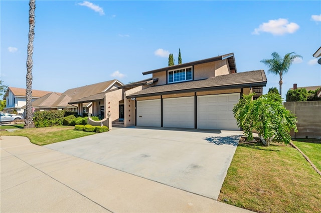 514 Mohawk Dr, Placentia, CA 92870 - view of front of home featuring a garage, stucco siding, concrete driveway, and a tiled roof