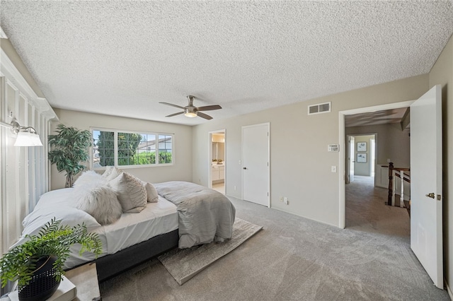 514 Mohawk Dr, Placentia, CA 92870 - bedroom featuring light colored carpet, a textured ceiling, ceiling fan, and ensuite bath