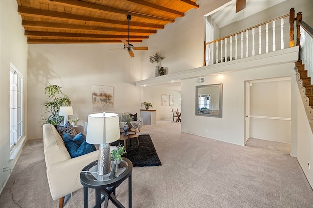 514 Mohawk Dr, Placentia, CA 92870 - living room with a ceiling fan, a wooden ceiling with exposed beams, carpet flooring, plenty of natural light, and a towering ceiling