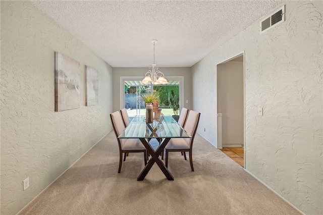 514 Mohawk Dr, Placentia, CA 92870 - dining area with a textured wall, a chandelier, light carpet, and a textured ceiling