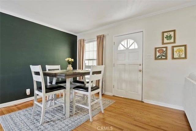 1414 W Jackman St, Lancaster, CA 93534 - dining room featuring light wood-style flooring and ornamental molding