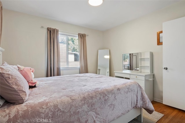 1414 W Jackman St, Lancaster, CA 93534 - bedroom featuring wood finished floors and baseboards