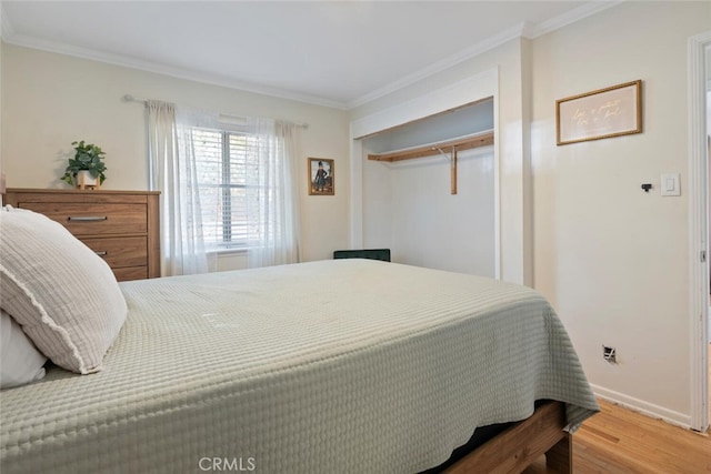 1414 W Jackman St, Lancaster, CA 93534 - bedroom with ornamental molding, wood finished floors, and a closet
