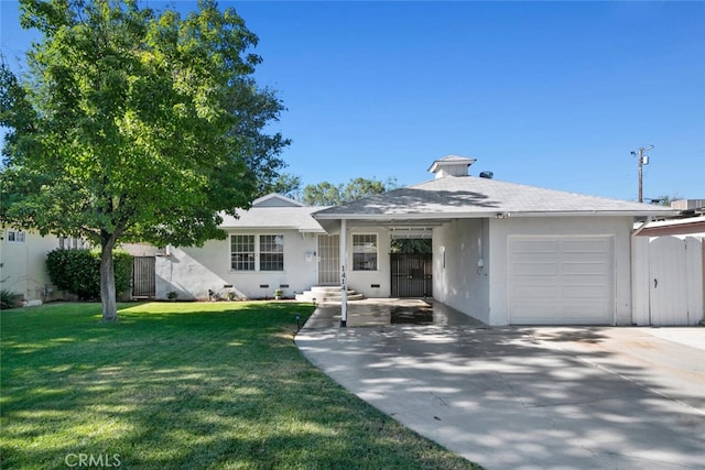 1414 W Jackman St, Lancaster, CA 93534 - view of front of house featuring a garage, stucco siding, a front lawn, and driveway