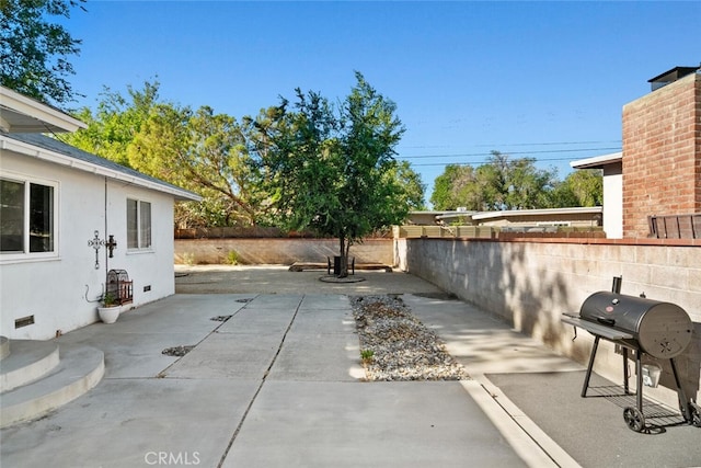 1414 W Jackman St, Lancaster, CA 93534 - fenced backyard featuring area for grilling and a patio area