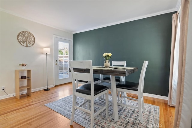 1414 W Jackman St, Lancaster, CA 93534 - dining room featuring light wood finished floors and crown molding