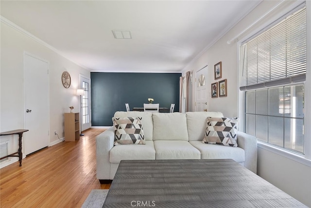 1414 W Jackman St, Lancaster, CA 93534 - living area with light wood-style flooring, healthy amount of natural light, and crown molding