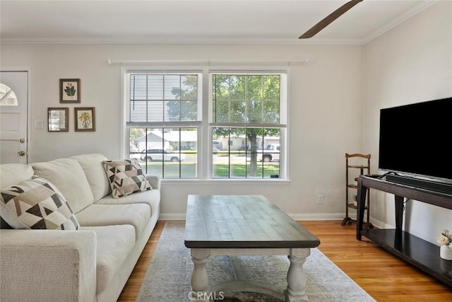 1414 W Jackman St, Lancaster, CA 93534 - living room featuring plenty of natural light, wood finished floors, ornamental molding, and a ceiling fan