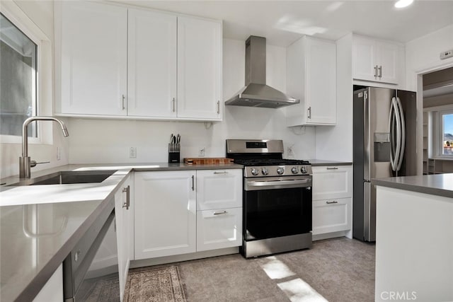 1414 W Jackman St, Lancaster, CA 93534 - kitchen featuring stainless steel appliances, wall chimney exhaust hood, white cabinets, recessed lighting, and dark countertops