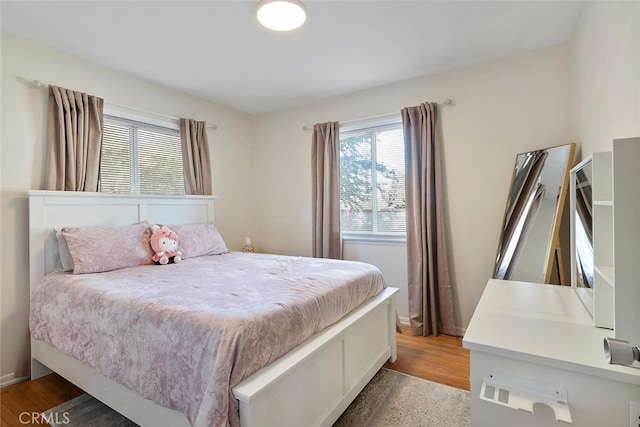 1414 W Jackman St, Lancaster, CA 93534 - bedroom featuring light wood-style floors and baseboards