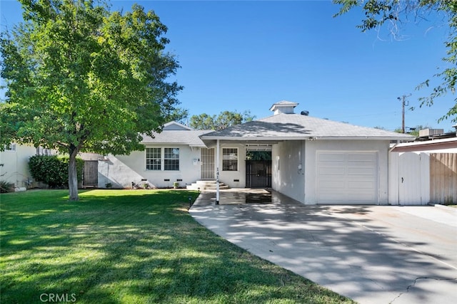 1414 W Jackman St, Lancaster, CA 93534 - ranch-style house with an attached garage, a front lawn, driveway, and stucco siding