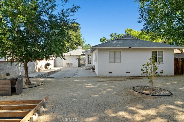 1414 W Jackman St, Lancaster, CA 93534 - rear view of property with entry steps, crawl space, a fenced backyard, a patio, and stucco siding