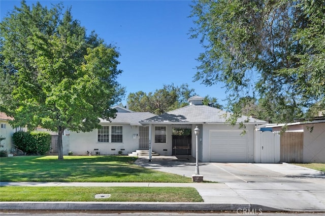 1414 W Jackman St, Lancaster, CA 93534 - ranch-style house featuring an attached garage, concrete driveway, and stucco siding