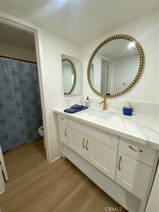 1640 Neil Armstrong St Unit 306, Montebello, CA 90640 - full bath with wood finished floors and vanity