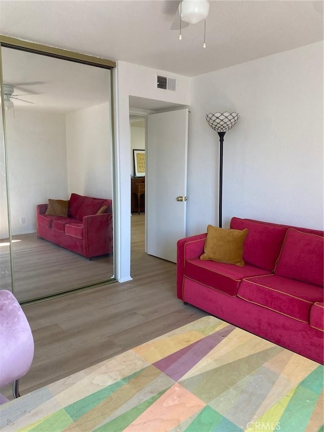 1640 Neil Armstrong St Unit 306, Montebello, CA 90640 - living area with a ceiling fan and wood finished floors
