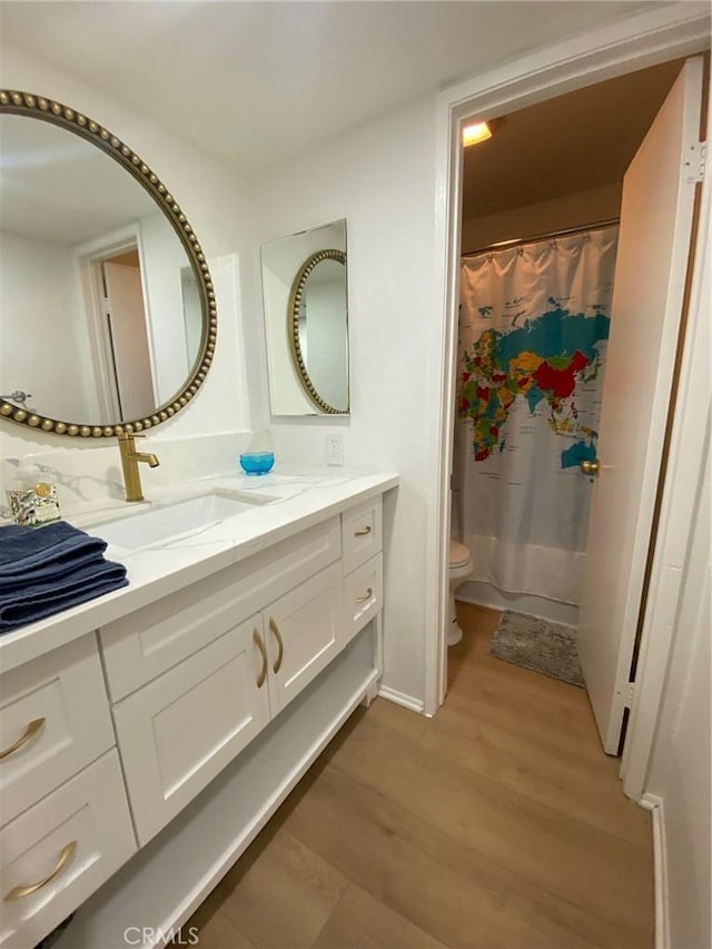 1640 Neil Armstrong St Unit 306, Montebello, CA 90640 - full bathroom featuring vanity and wood finished floors