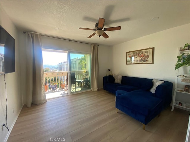 1640 Neil Armstrong St Unit 306, Montebello, CA 90640 - living area with ceiling fan, light wood-type flooring, and a textured ceiling