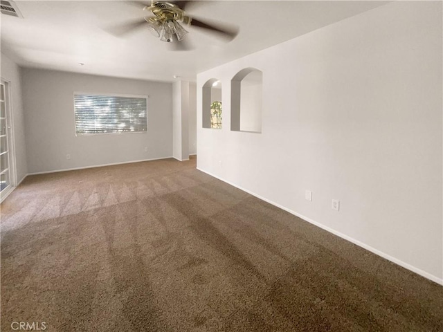 15617 Lasselle St Unit 31, Moreno Valley, CA 92551 - unfurnished room featuring ceiling fan, carpet, and arched walkways