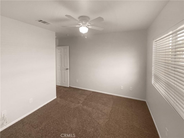 15617 Lasselle St Unit 31, Moreno Valley, CA 92551 - empty room featuring a ceiling fan and dark carpet