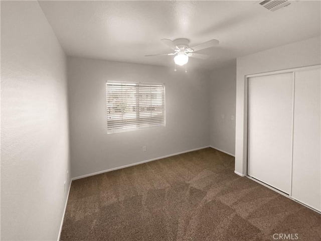 15617 Lasselle St Unit 31, Moreno Valley, CA 92551 - unfurnished bedroom featuring carpet floors, a closet, and ceiling fan