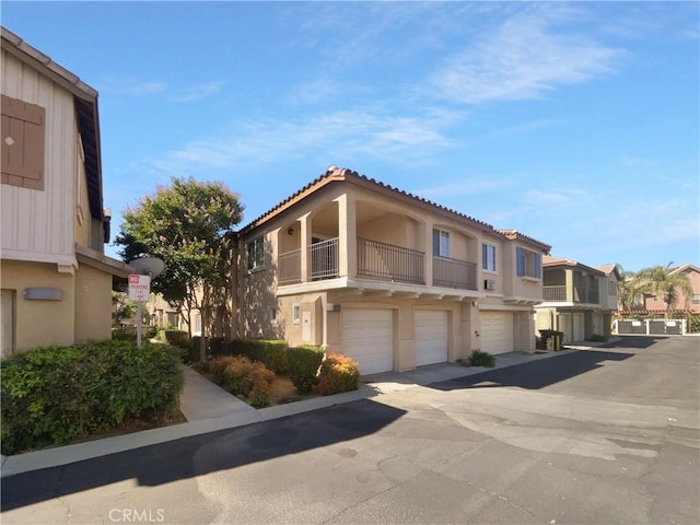 15617 Lasselle St Unit 31, Moreno Valley, CA 92551 - view of building exterior featuring a residential view and an attached garage