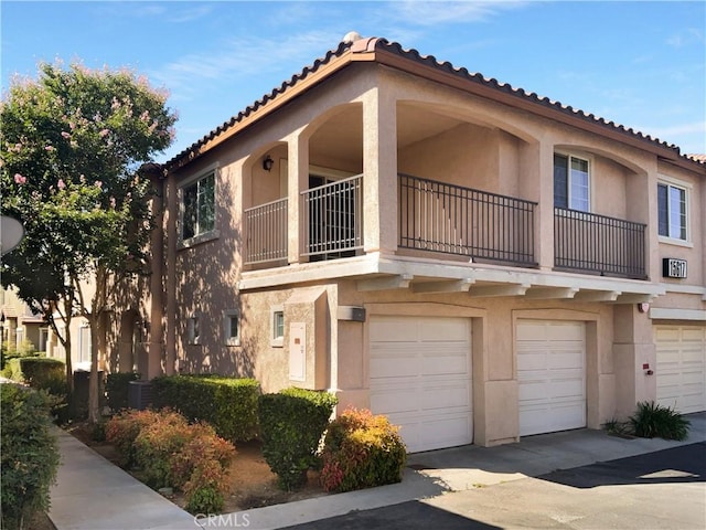 15617 Lasselle St Unit 31, Moreno Valley, CA 92551 - view of building exterior with a garage