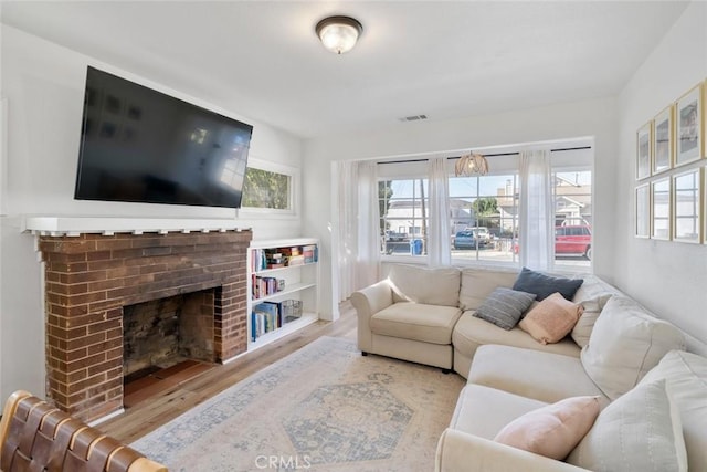 2082 Harris St, San Luis Obispo, CA 93401 - living room featuring wood finished floors and a fireplace