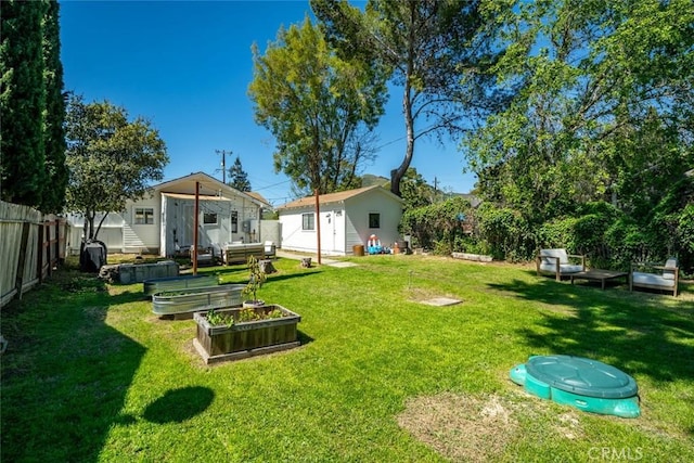 2082 Harris St, San Luis Obispo, CA 93401 - fenced backyard with a garden and an outbuilding