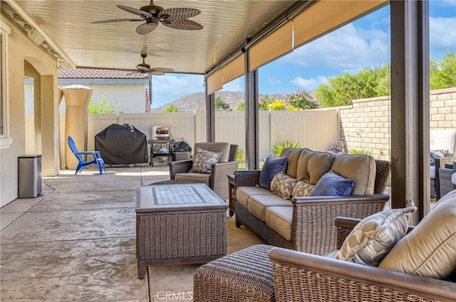 30159 Honor Ct, Menifee, CA 92584 - fenced backyard featuring an outdoor hangout area, a ceiling fan, and a patio area