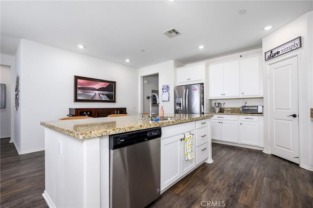 30159 Honor Ct, Menifee, CA 92584 - kitchen with appliances with stainless steel finishes, dark wood-type flooring, light stone countertops, white cabinetry, and recessed lighting
