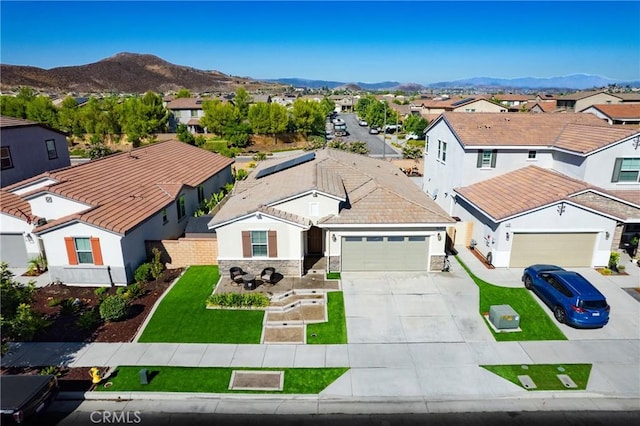 30159 Honor Ct, Menifee, CA 92584 - view of front facade with a residential view, driveway, an attached garage, a mountain view, and a tiled roof