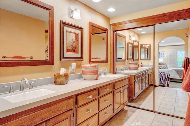 6272 Riviera Cir, Long Beach, CA 90815 - ensuite bathroom with double vanity, tile patterned floors, and recessed lighting