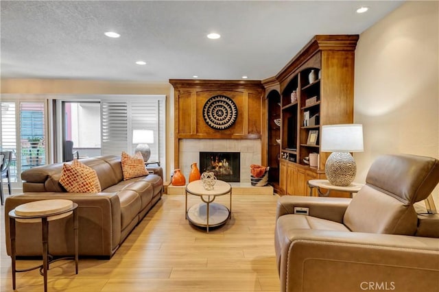 6272 Riviera Cir, Long Beach, CA 90815 - living area with recessed lighting, light wood-style floors, and a fireplace
