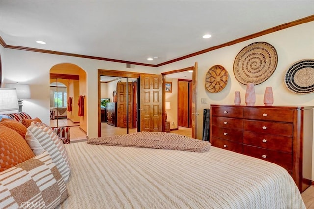 6272 Riviera Cir, Long Beach, CA 90815 - bedroom featuring arched walkways, recessed lighting, crown molding, and a closet