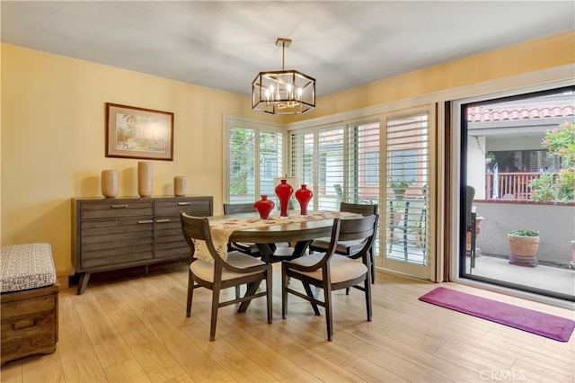 6272 Riviera Cir, Long Beach, CA 90815 - dining space with a chandelier and light wood-style flooring