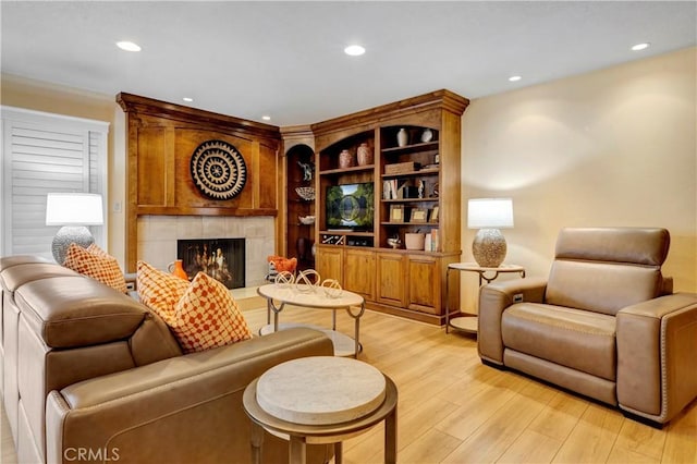 6272 Riviera Cir, Long Beach, CA 90815 - living room featuring light wood-style floors, recessed lighting, and a tile fireplace