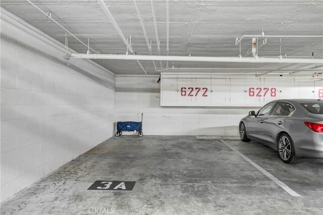 6272 Riviera Cir, Long Beach, CA 90815 - parking garage featuring concrete block wall