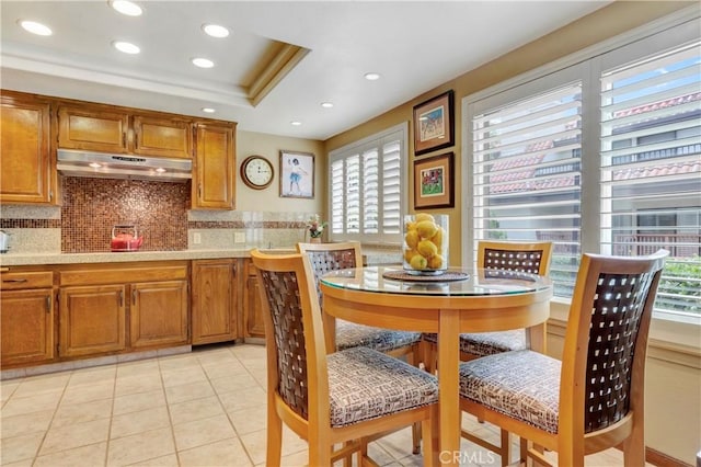 6272 Riviera Cir, Long Beach, CA 90815 - kitchen featuring under cabinet range hood, light countertops, brown cabinets, and recessed lighting