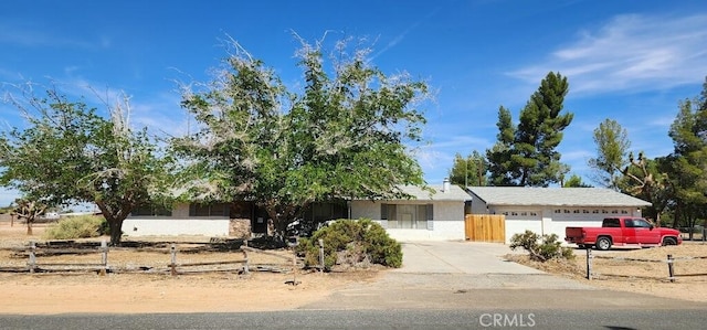 14450 Jicarilla Rd, Apple Valley, CA 92307 - view of front of property with concrete driveway, an attached garage, and stucco siding